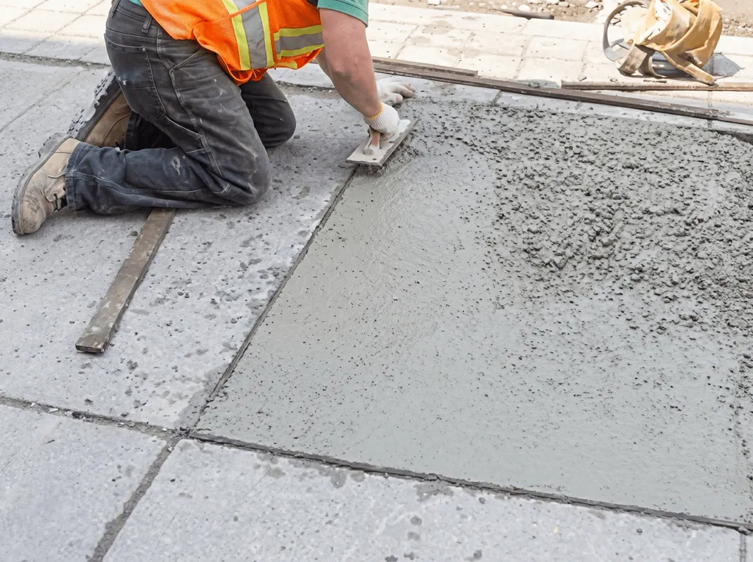 Professional repairing a concrete floor in Seattle, WA